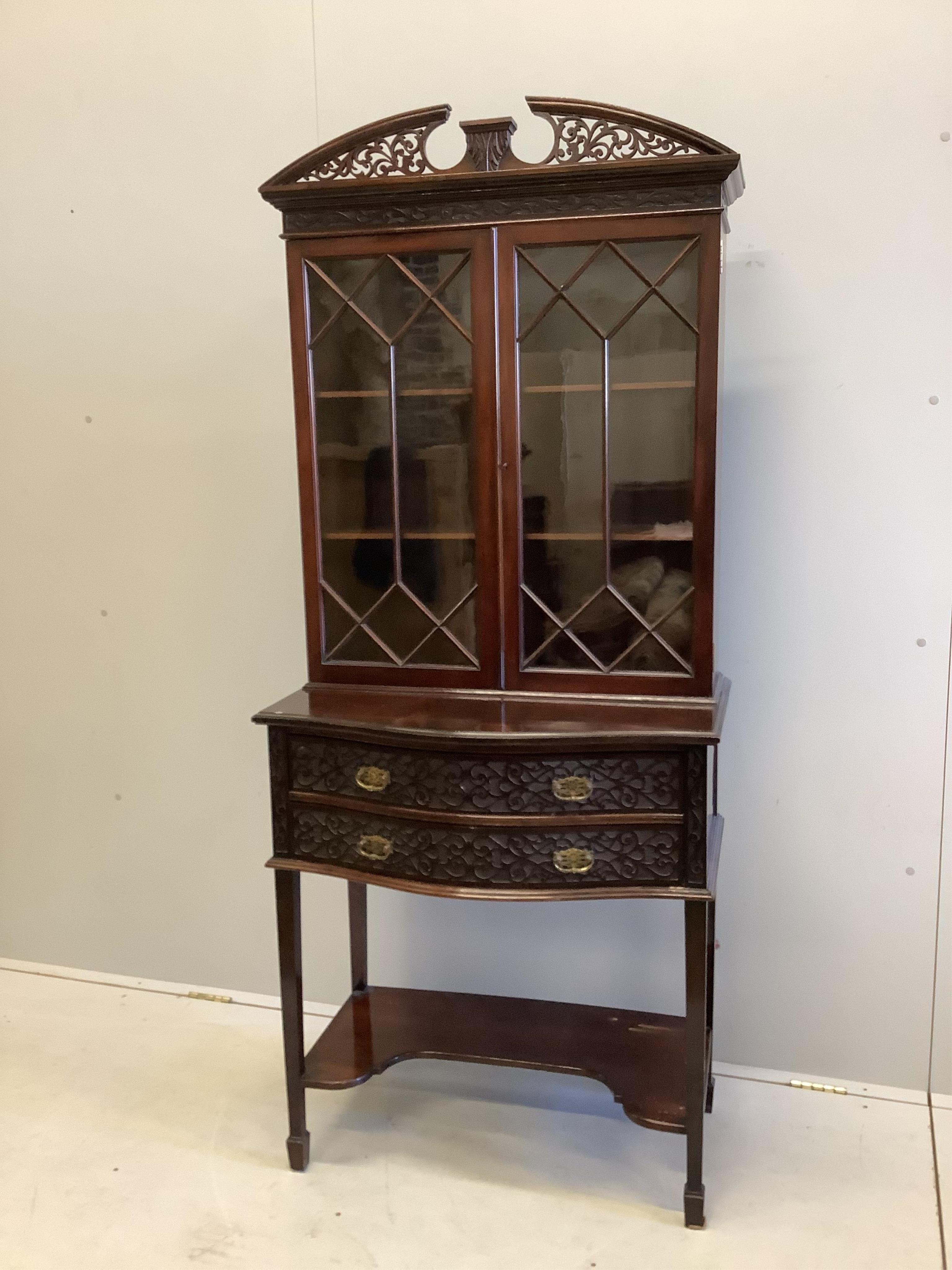 An Edwardian Chippendale Revival blind fret bowfront mahogany bookcase, width 76cm, depth 44cm, height 180cm